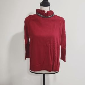 Red neck embellished long sleeve sweater